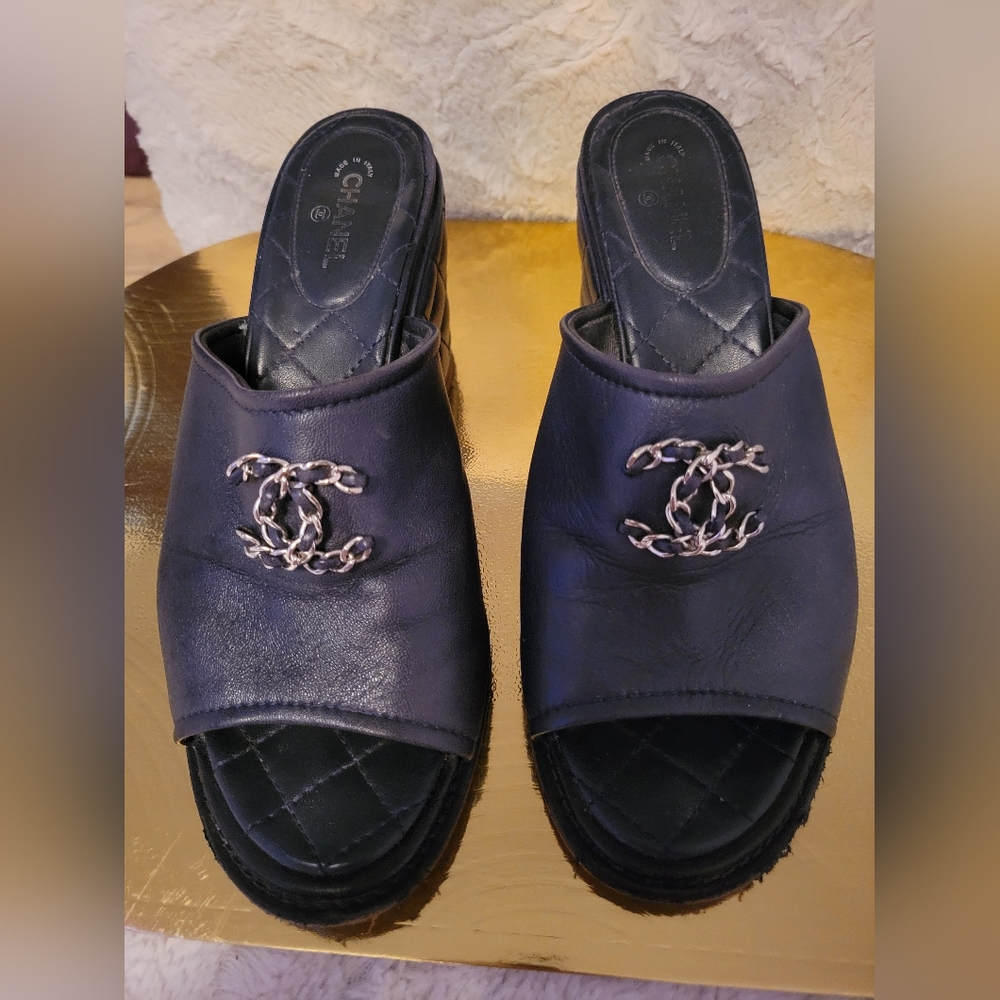 CHANEL Black Mules with Elegant Open Toe and Silver Logo